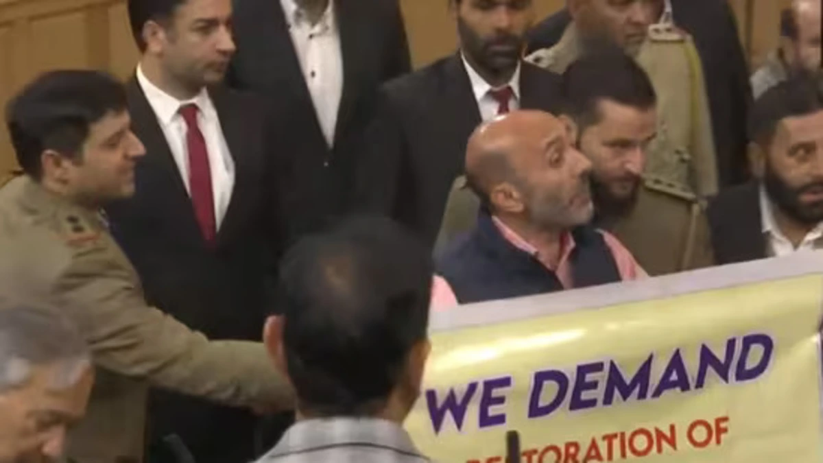 Engineer Rashid’s Brother Unveils Article 370 Banner in J&K Assembly, Sparking Tensions