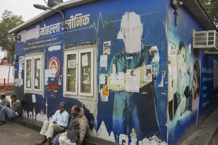 Delhi hospital with overcrowded waiting areas, highlighting staff shortages and lack of medical facilities.