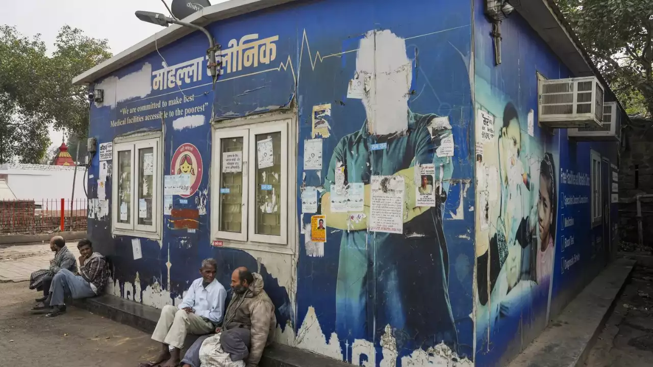Delhi hospital with overcrowded waiting areas, highlighting staff shortages and lack of medical facilities.