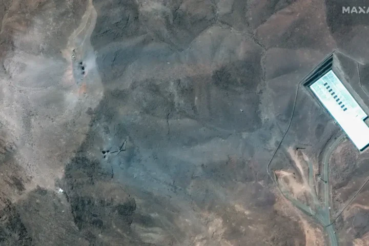 Overview of Iran’s Fordow nuclear site showing surface disruption after US bunker-buster airstrike on June 22, 2025.
