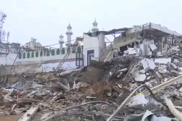 Delhi Police and RAF deployed during anti-encroachment demolition near Faiz-e-Elahi Mosque at Turkman Gate following violent clashes