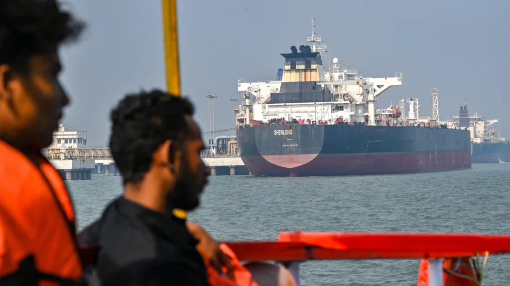 Shenlong Suezmax oil tanker arriving at Mumbai port after navigating the Strait of Hormuz during GPS jamming and rising US-Iran conflict tensions.