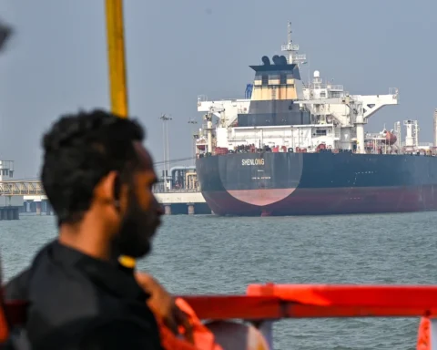 Shenlong Suezmax oil tanker arriving at Mumbai port after navigating the Strait of Hormuz during GPS jamming and rising US-Iran conflict tensions.