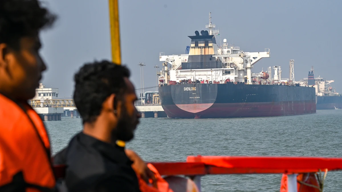 Shenlong Suezmax oil tanker arriving at Mumbai port after navigating the Strait of Hormuz during GPS jamming and rising US-Iran conflict tensions.