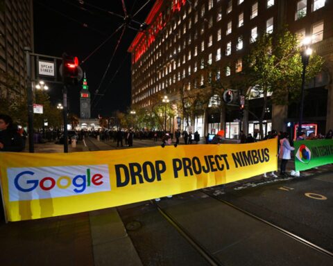 Students protesting Google's Project Nimbus contract during an event featuring CEO Sundar Pichai.