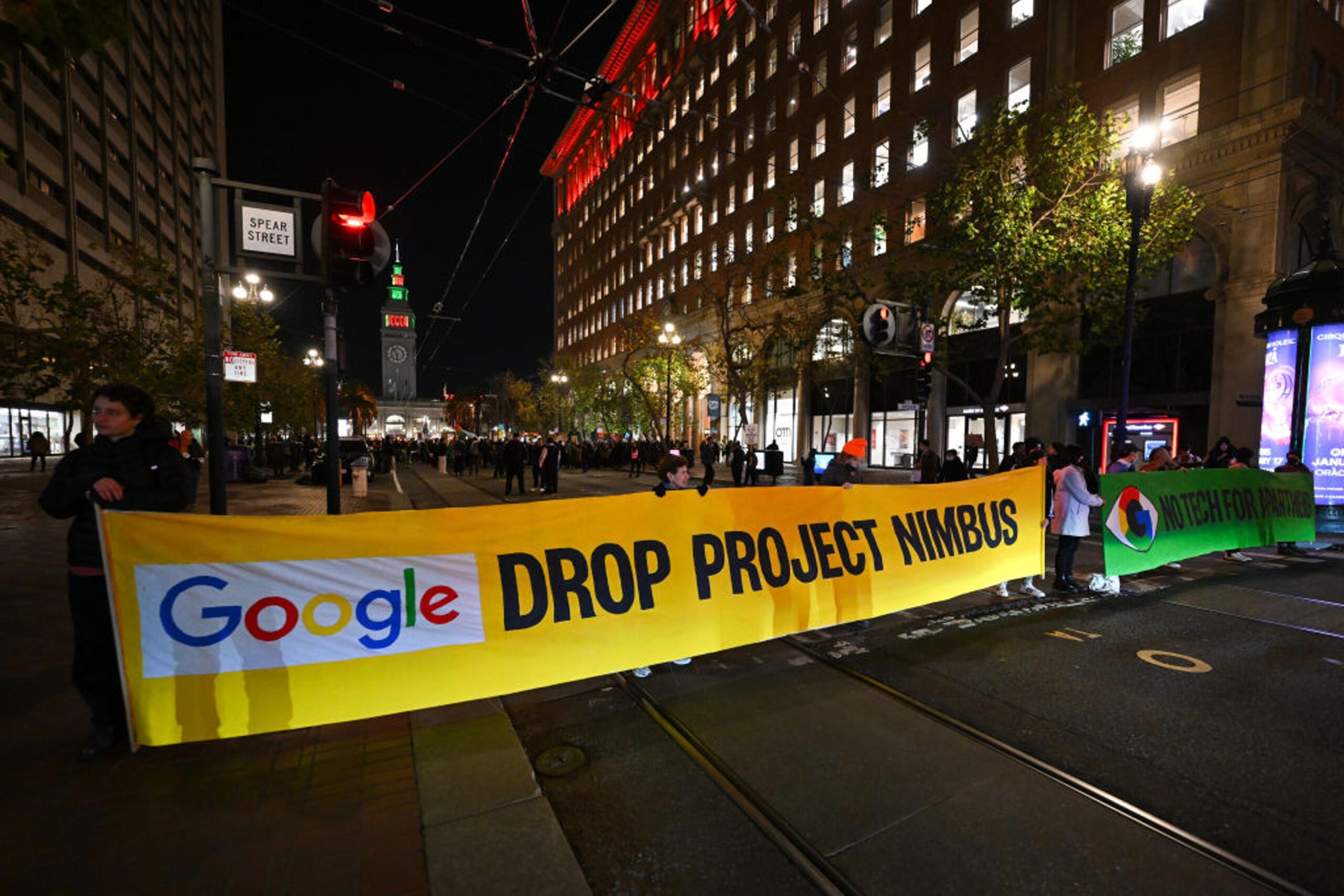 Students protesting Google's Project Nimbus contract during an event featuring CEO Sundar Pichai.