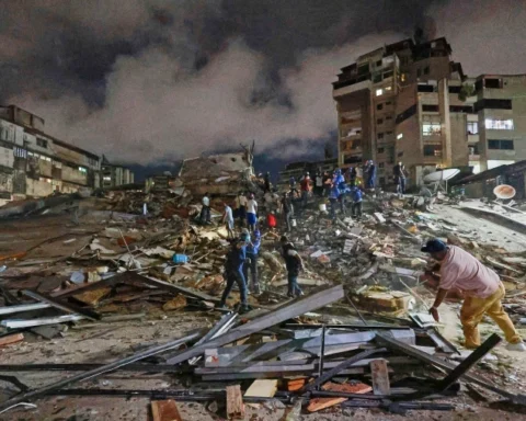 Rescue personnel search through collapsed buildings after a powerful earthquake struck Venezuela, leaving hundreds dead and thousands injured.