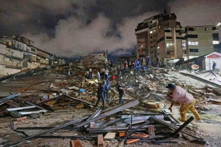 Rescue personnel search through collapsed buildings after a powerful earthquake struck Venezuela, leaving hundreds dead and thousands injured.