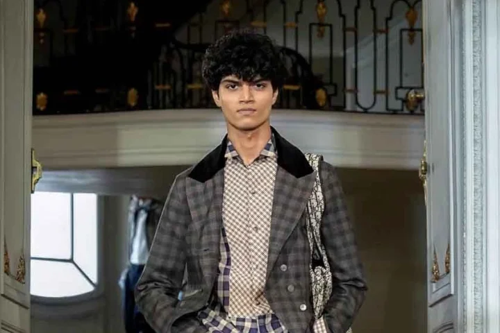 Indian model and mechanical engineering student Yug Sanjay Devalia walking the runway during the Dior Menswear Spring Summer 2027 fashion show in Paris.